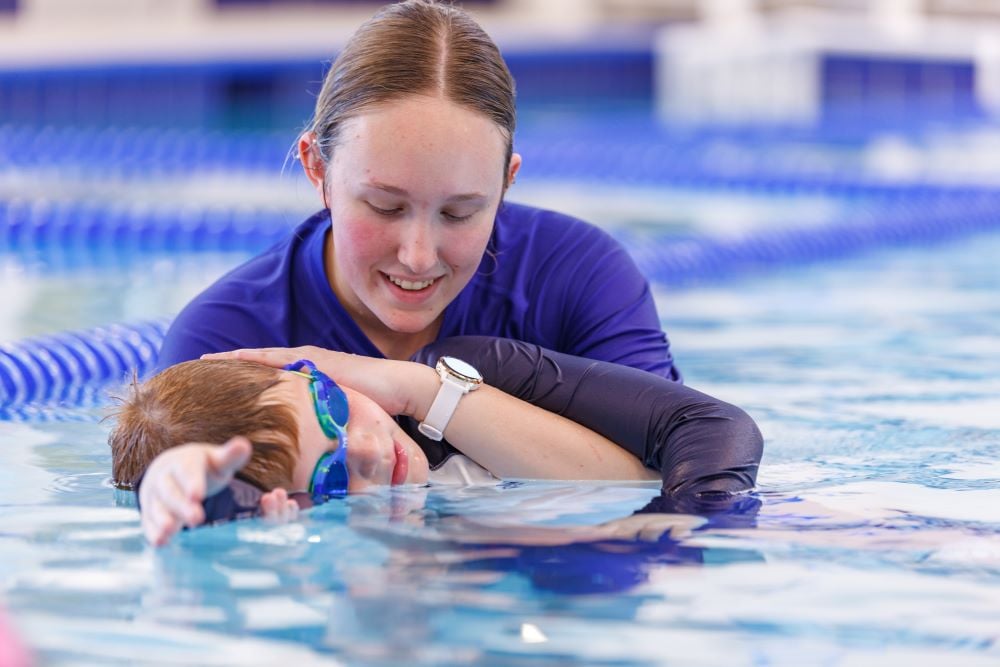 swim instructor and student